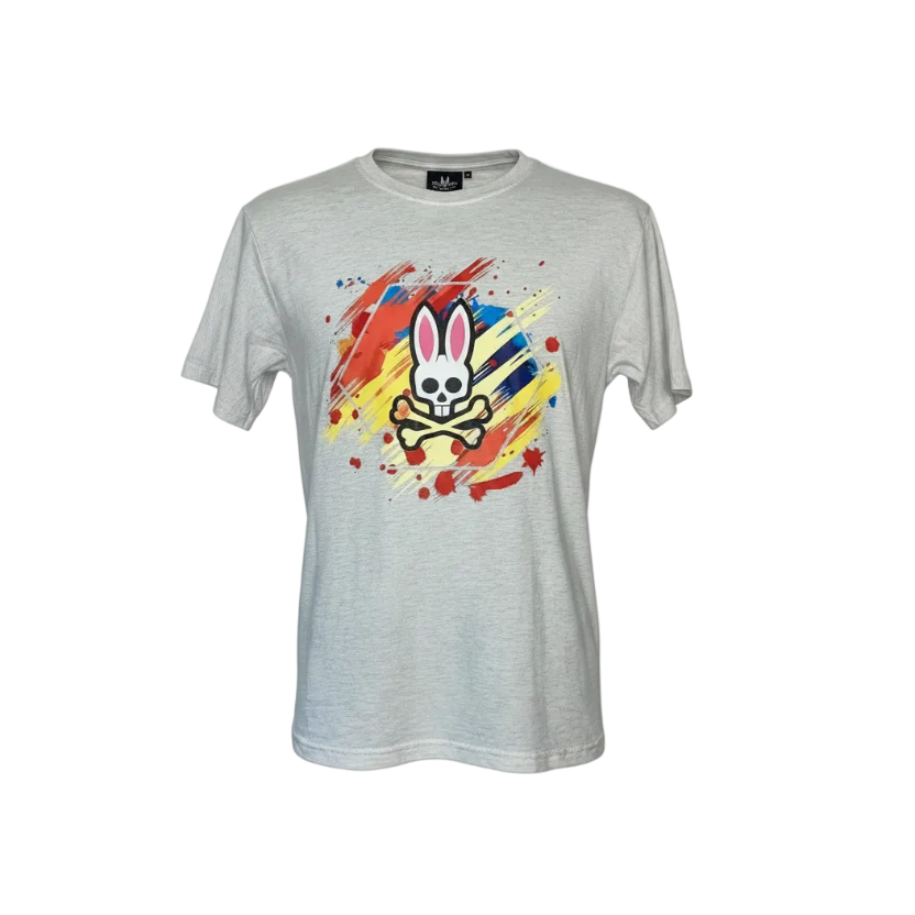 Playera premium Psycho Bunny blanca con logo en colores, de la marca Selah Boutique, visible en la imagen.